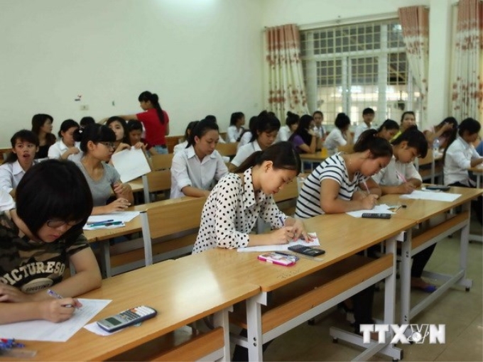 Các thí sinh tham dự kỳ thi đại học, cao đẳng năm 2014. (Ảnh: Quý Trung/TTXVN)